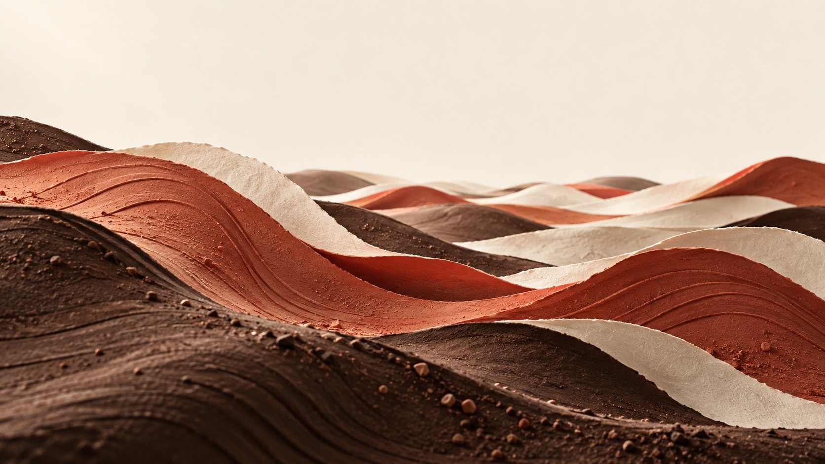 Layers of terracotta clay and cream paper spread into soft, rippling hills.